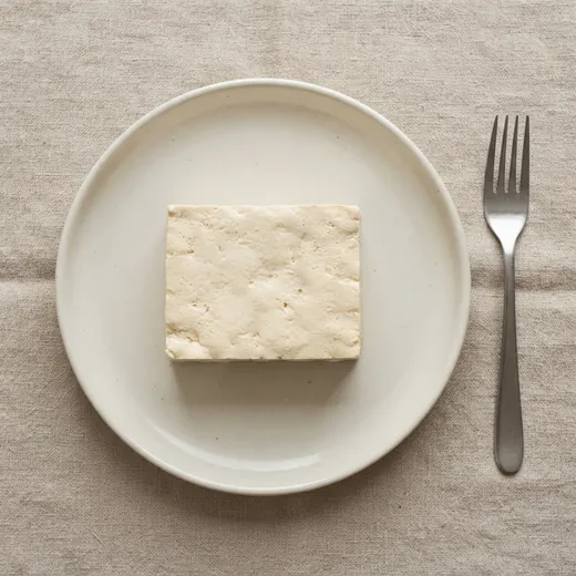 Firm tofu, 150&nbsp;g, on a plate